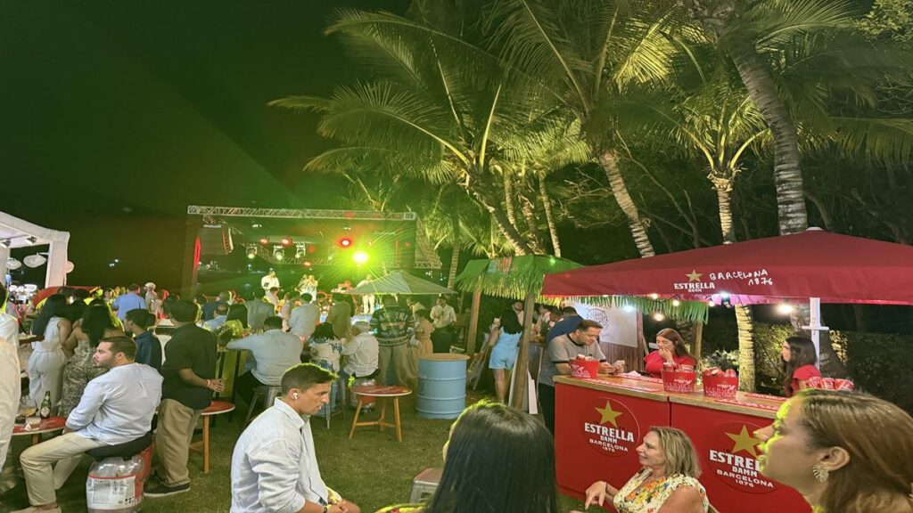 Outdoor live music stage and Estrella Damm beer stand at the festival