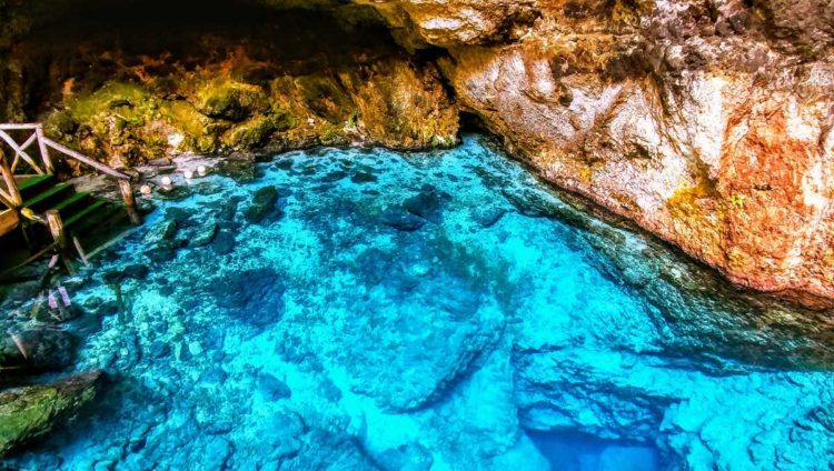 The Hoyo Azul at Scape Park Cap Cana, a crystal-clear freshwater lagoon