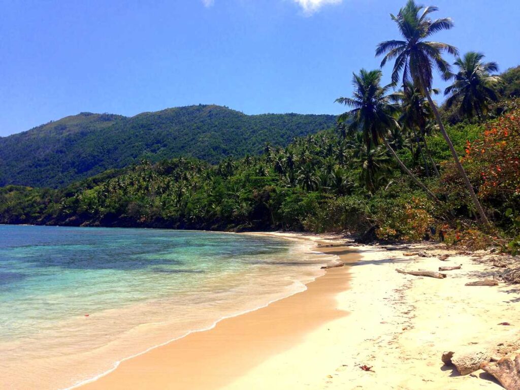 Playa Ermitano I, a remote and pristine beach on the Samaná peninsula, accessible by hike or boat only