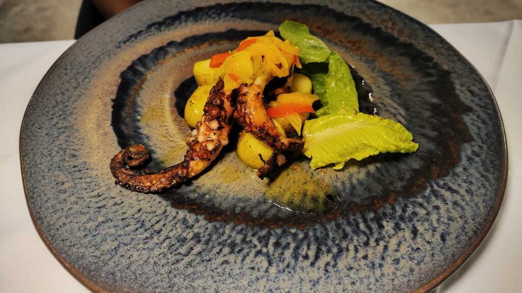 Dinner with octopus dish presentation