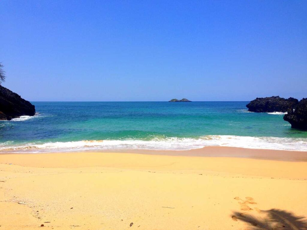 Playa Onda Samana, a remote and pristine beach on the Samaná peninsula, accessible by hike or boat only