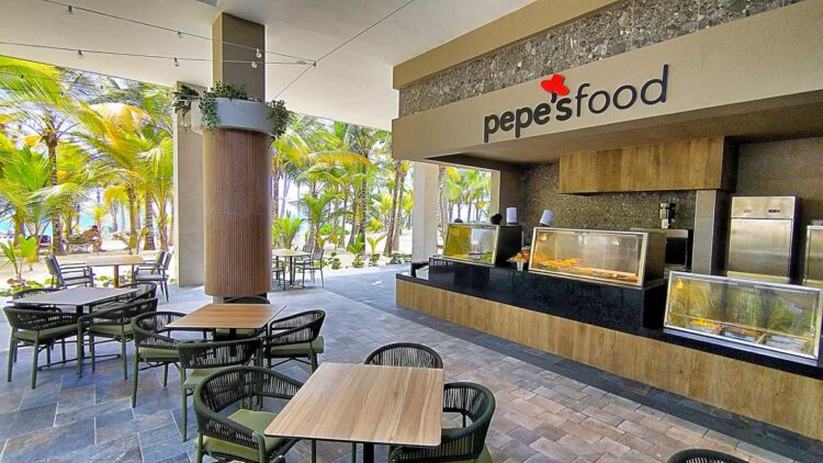 Spacious food court with buffet stations at Riu Palace Bavaro