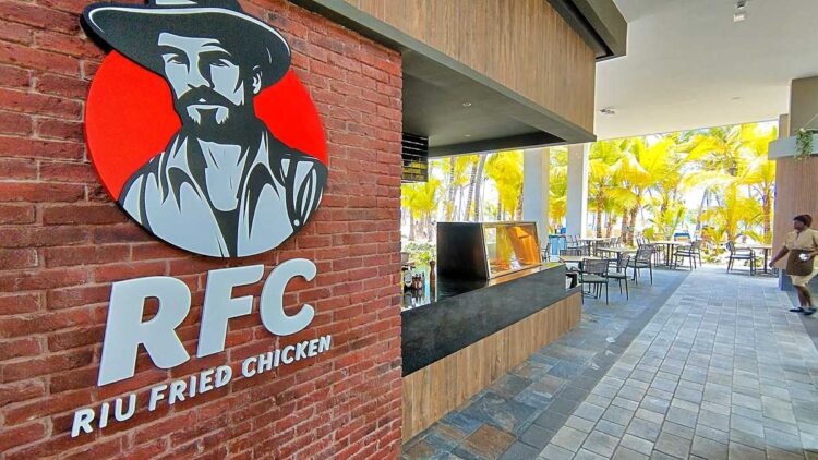 Spacious food court with buffet stations at Riu Palace Bavaro