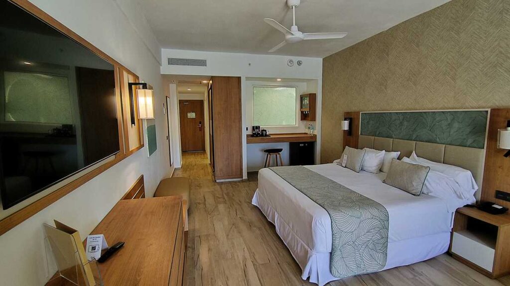 The modern hotel room with king-size bed at Riu Palace Bavaro