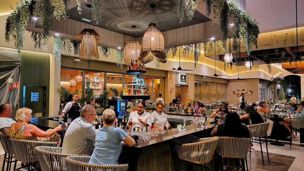 The stylish bar with cocktails and seating at Riu Palace Bavaro