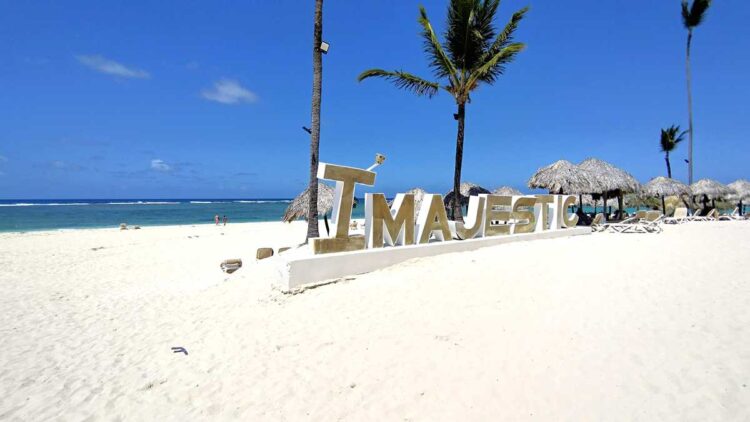 The Majestic Colonial sign at the beach, welcoming guests to the resort