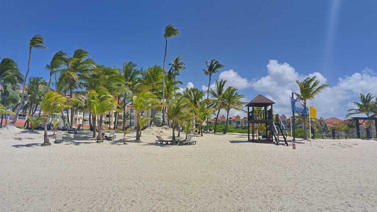 The scenic view of the beach at Occidental Caribe Beach with white sand and clear waters