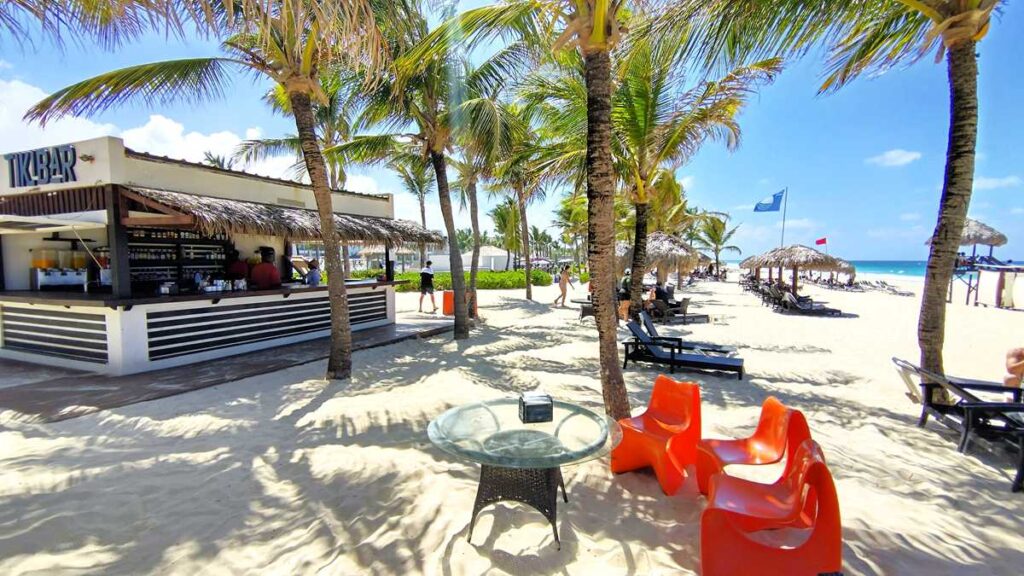 A tropical Tiki Bar at Hard Rock Hotel & Casino Punta Cana serving refreshing cocktails by the beach