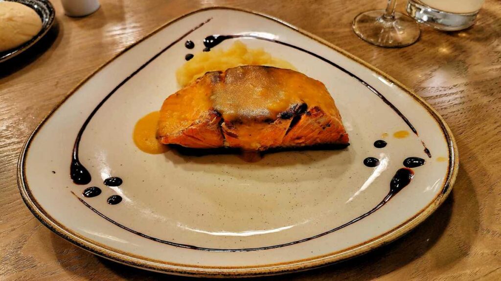 Gourmet salmon dish served with elegance at Meliá Punta Cana Beach Resort
