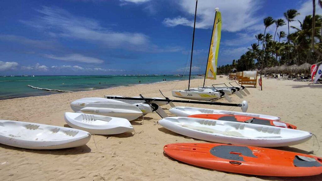 A row of kayaks available for guests on the beach at Melia Punta Cana Beach Resort