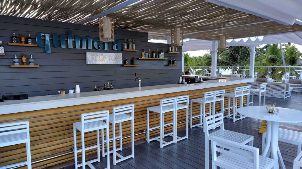 The rooftop bar at Melia Punta Cana Beach Resort with tropical seating and tropical vibes